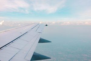 Airplane Window | How to Use a Credit Card to Earn Travel Points & Rewards - The Wanderful Soul Travel Blog
